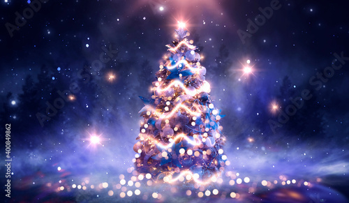 Night winter forest fantasy landscape with a Christmas decorated tree. Festive bokeh lights, dark forest, neon lights. Decorated Christmas tree in the night forest. Background for postcards. 3D  © MiaStendal