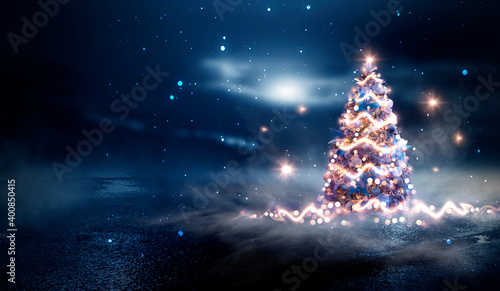 Night winter forest fantasy landscape with a Christmas decorated tree. Festive bokeh lights, dark forest, neon lights. Decorated Christmas tree in the night forest. Background for postcards. 3D 