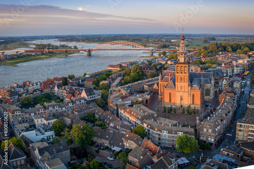 Netherlands, Gelderland, Nijmegen, Aerial view of Saint Stephens Church and surrounding buildings at dusk photo