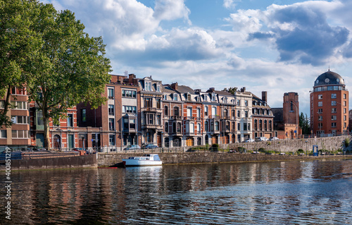 Belgium, Liege Province, Liege, City canal stretching in front of row of townhouses