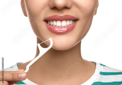 Young woman flossing her teeth on white background  closeup. Cosmetic dentistry