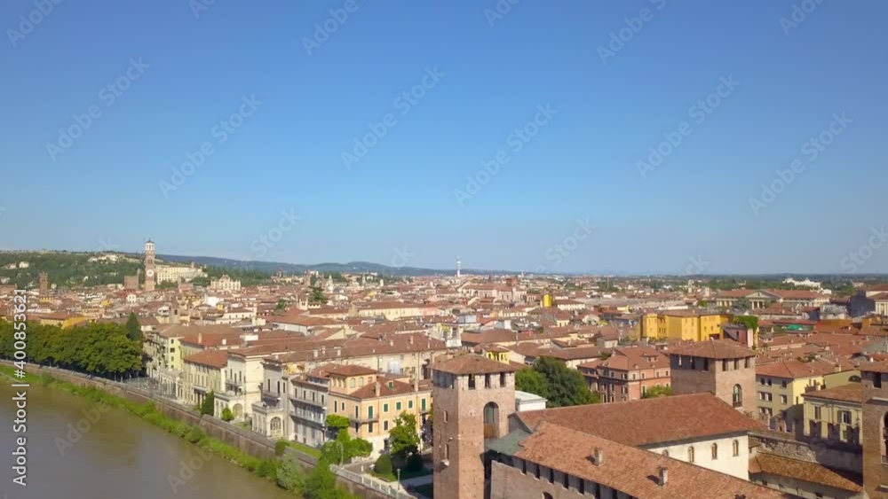 Verona, Italy: Aerial view of Castelvecchio Castle. Flying over the historic city center with typical Italian apartment rooftops. Drone flies over the old city. Aerial video footage in 4K. Verona, Italy: Aerial view of Castelvecchio Castle. Flying over the historic city center with typical Italian apartment rooftops. Drone flies over the old city. Aerial video footage in 4K.