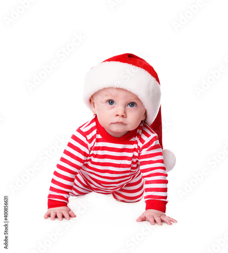 Cute baby in Santa hat and bright Christmas pajamas on white background