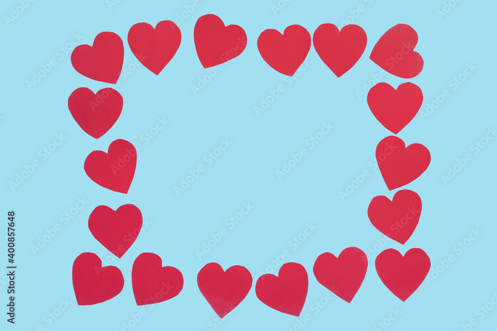 blue background with the frame made from red hearts. Valentines day concept