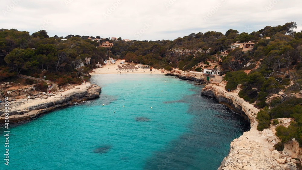 Fototapeta premium Natural Arch Rock Es Pontas, between Cala Santanyí and Cala Llombards, Mallorca, Balearic Islands, Spain, aerial drone shot. High quality photo