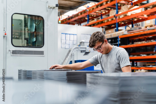 Male technician analyzing product in industry