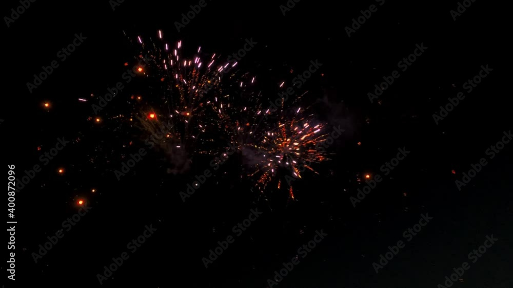 A small fireworks display lights up the night sky. A small fireworks display lights up the night sky.
