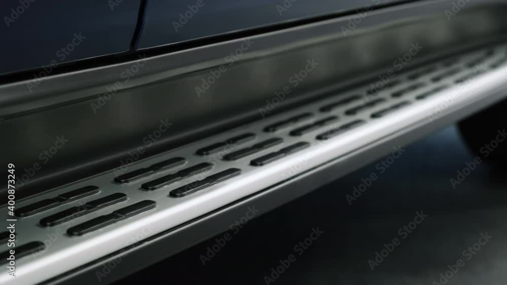 Protruding metal door sill with rubber pads on the car for a comfortable fit into the cabin. Car threshold. Protruding metal door sill with rubber pads on the car for a comfortable fit into the cabin. Car threshold.