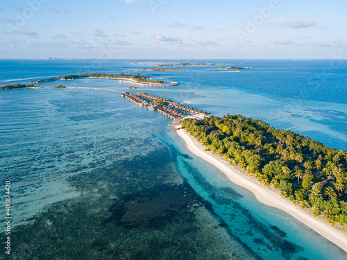 Maldives, Kaafu Atoll, Aerial view of green grove on Huraa island photo