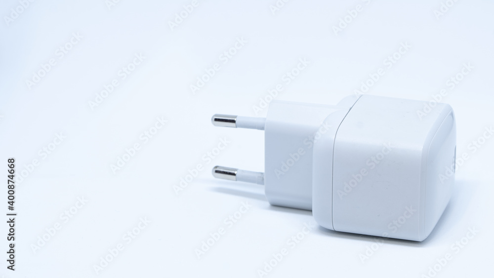 AC adaptor for mobile equipment batteries charging with one output port and connected cable with USB-C connectors on a white isolated background AC adaptor for mobile equipment batteries charging with one output port and connected cable with USB-C connectors on a white isolated background