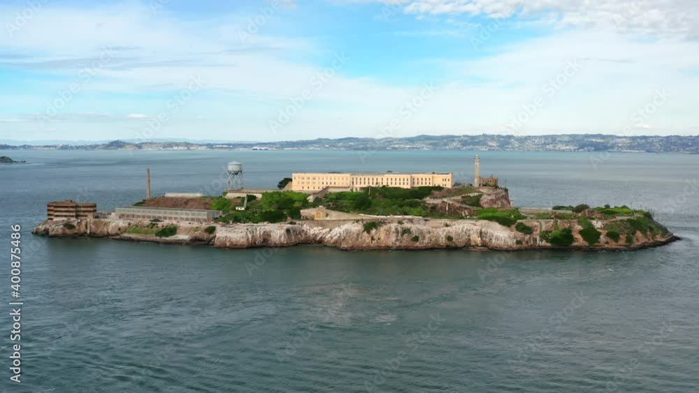 San Francisco, USA. Aerial view of historic landmark surrounded by the ocean. Alcatraz Federal Penitentiary with coastline of The City in the background. High quality 4k footage San Francisco, USA. Aerial view of historic landmark surrounded by the ocean. Alcatraz Federal Penitentiary with coastline of The City in the background. High quality 4k footage