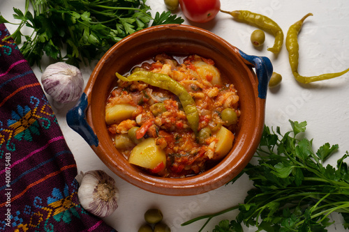 Mexican style cod called a la vizcaina on white background photo