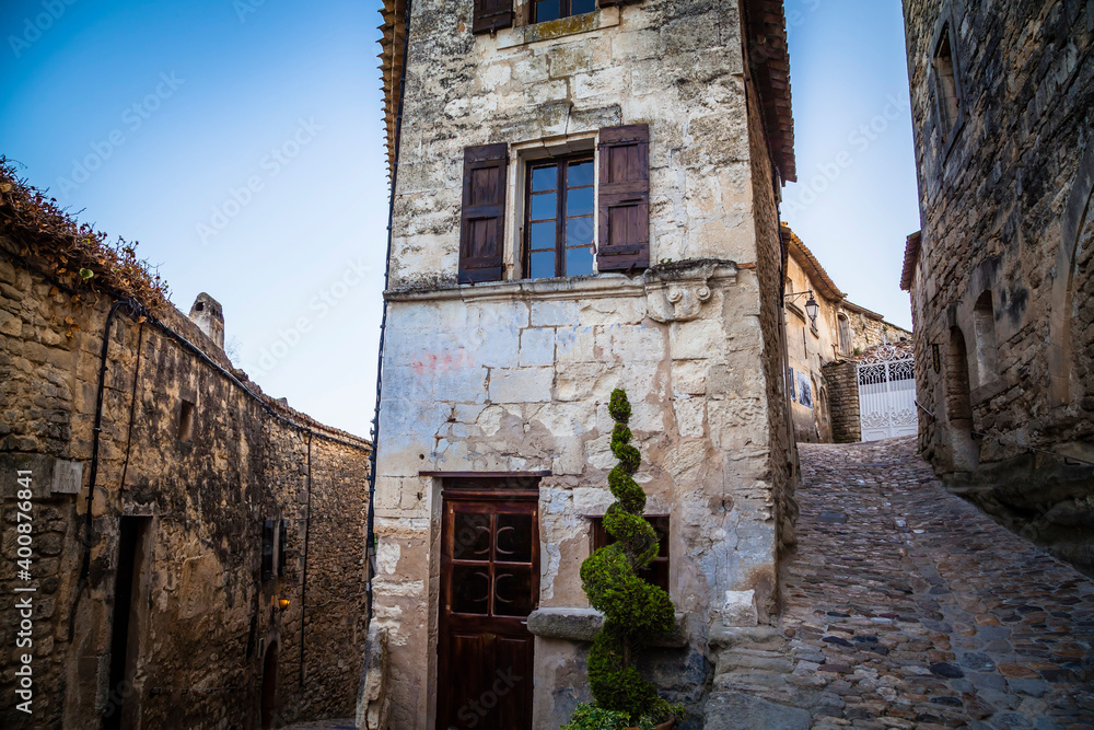 Old houses in the streets of the ancient village Lacoste in Provence, France