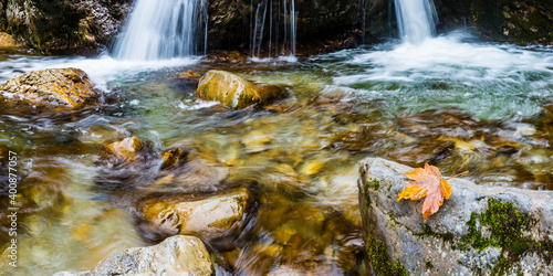 Waterfall and creek in Autumn photo