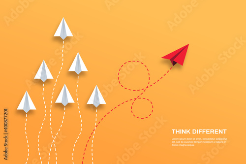 Think differently concept. Red airplane changing direction. Concepts: change, unique, trend, courage, innovation, different.