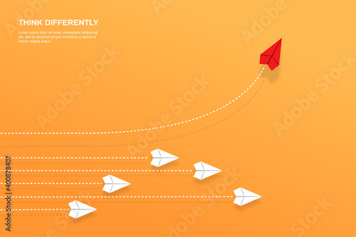 Think differently concept. Red airplane changing direction. Concepts: change, unique, trend, courage, innovation, different.
