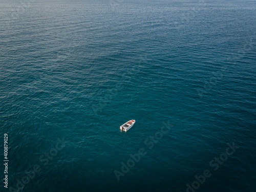 The lonely boat on blue