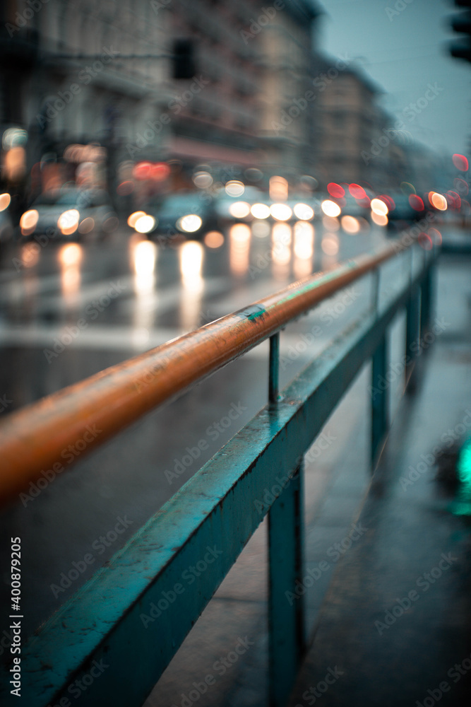 green and yellow barrier in the rainy city