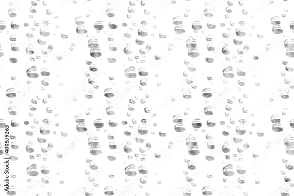 gray-white oval drops of water on a transparent glass
