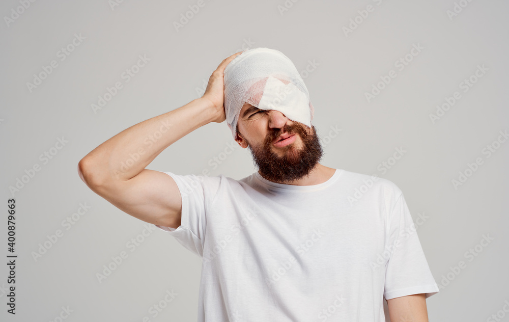 man with a bandaged head health problems trauma emergency room hospitalization