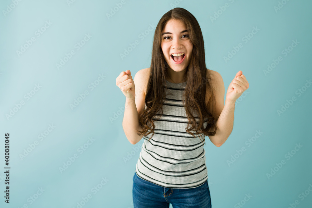 Portrait of a woman excited because she received good news Portrait of a woman excited because she received good news