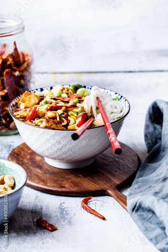 Vegan¬†Kung¬†Pao¬†with tofu, capsicum, peanuts, rice noodles photo