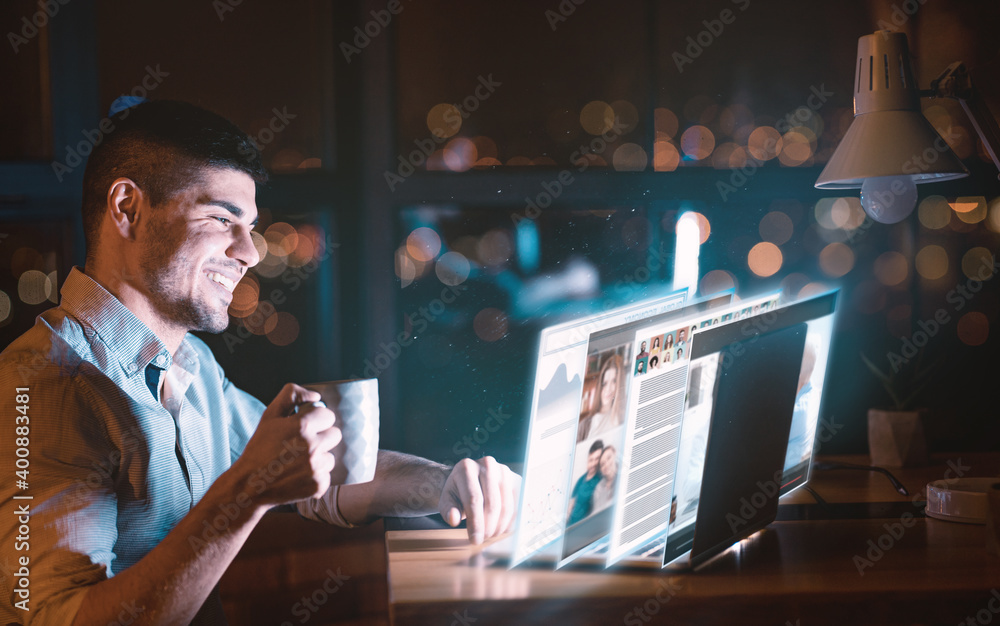 Man Sitting At Laptop Networking Reading Online News In Office