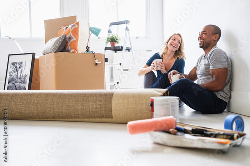 Multi ethnic couple in new apartment photo