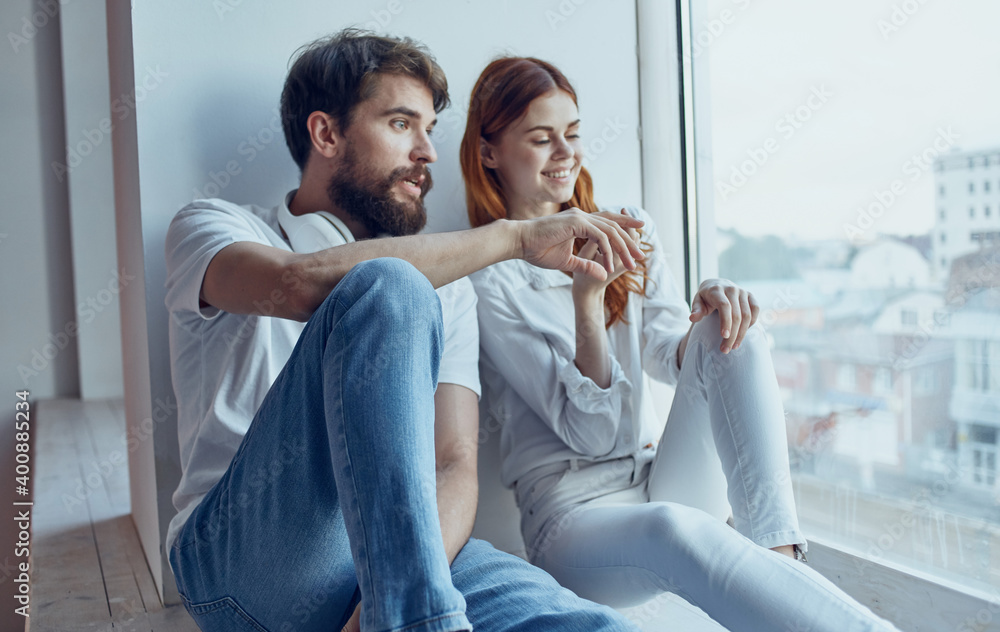 man and woman near the window rest interior fun lifestyle man and woman near the window rest interior fun lifestyle