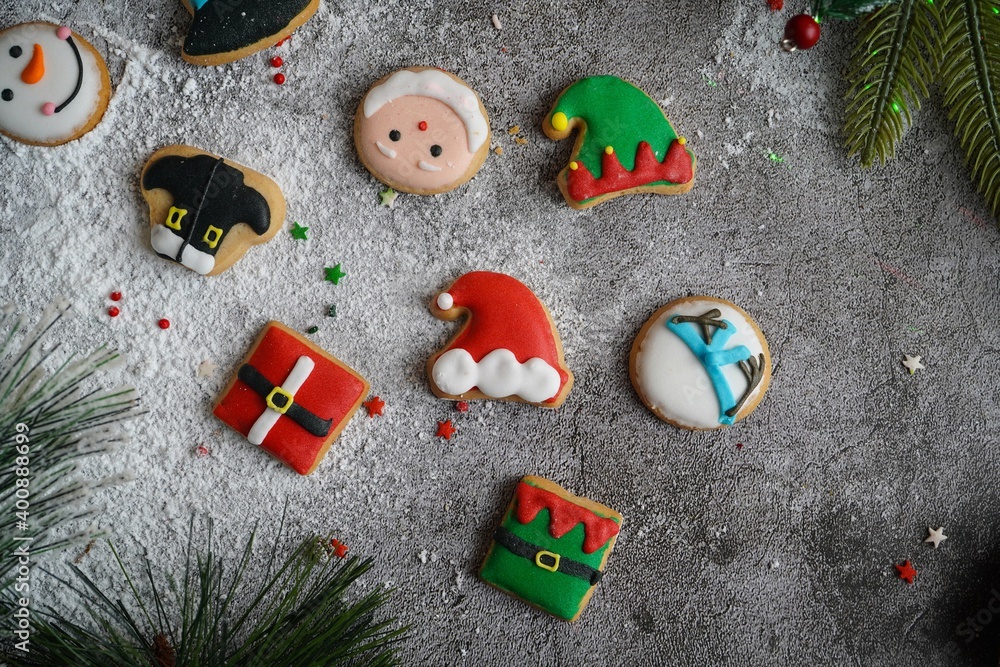 Decorated Christmas / Xmas cookies on festive holiday background