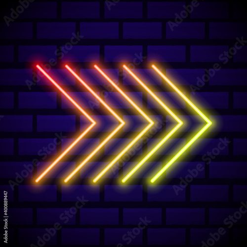 Neon glowing arrow pointer on dark brick wall background. Colorful and shining retro light sign. Vector design element.
