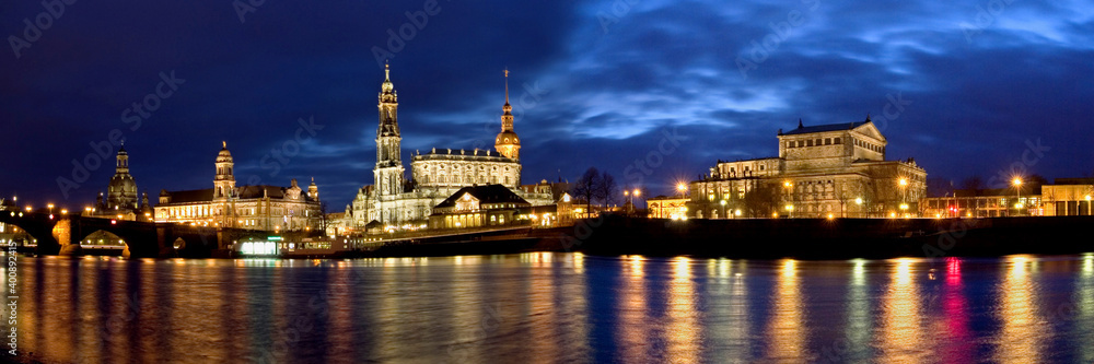 Dresden - Old town panorama reflected in the Elbe at the blue hour