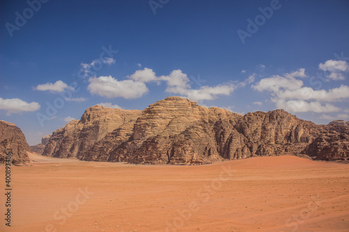 picturesque beautiful desert landscape panoramic scenic view nature photography in Wadi Rum famous touristic site of Jordan Middle East country region rocky mountains background