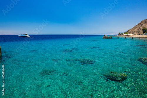 beautiful panoramic nature landscape scenic view of Red sea lagoon water and coral riffs shore line idyllic summer vacation destination place in Israel