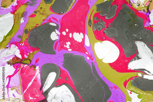 Colorful marble ink texture on watercolor paper background. Marble stone image. Bath bomb effect. Psychedelic biomorphic art.