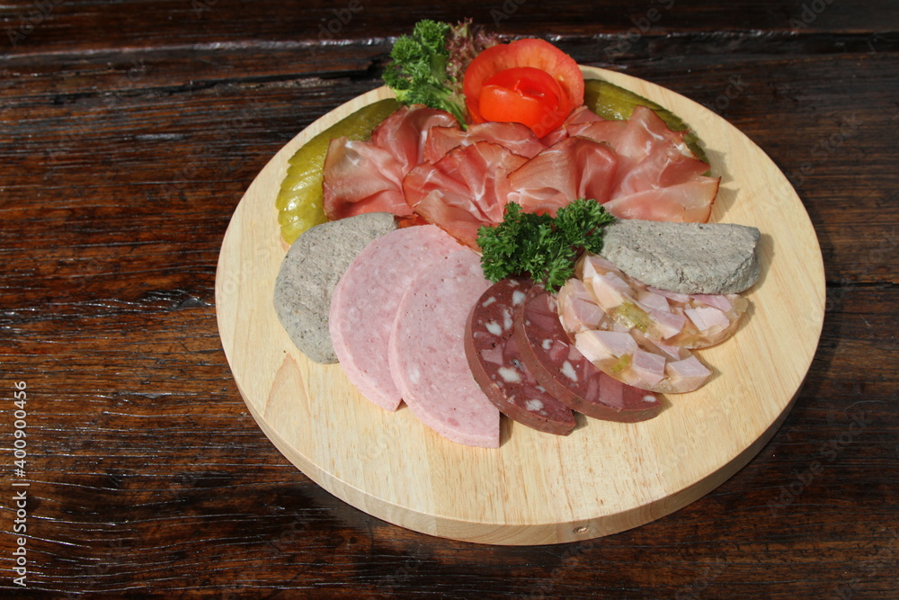 Bauernvesper, German farmer's meal with Black Forest ham and a variation of German sausages and gherkins