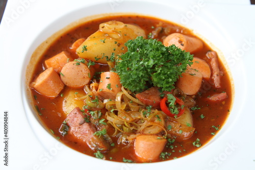 Potato goulash with sausages and bacon