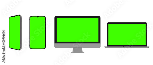 Three devices with green screen mockup. Smartphone
in two positions, computer and laptop with place for advertising, copy space. Modern gadgets with chromakey space on screen. 