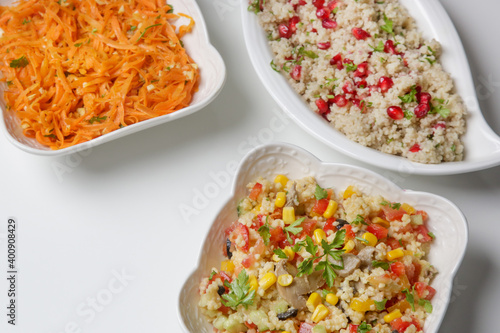 Various vegetarian salad in bowls on the tabe