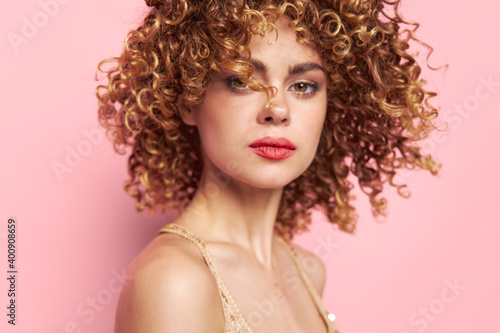 Beautiful woman Close-up curly hair portrait. bright makeup 