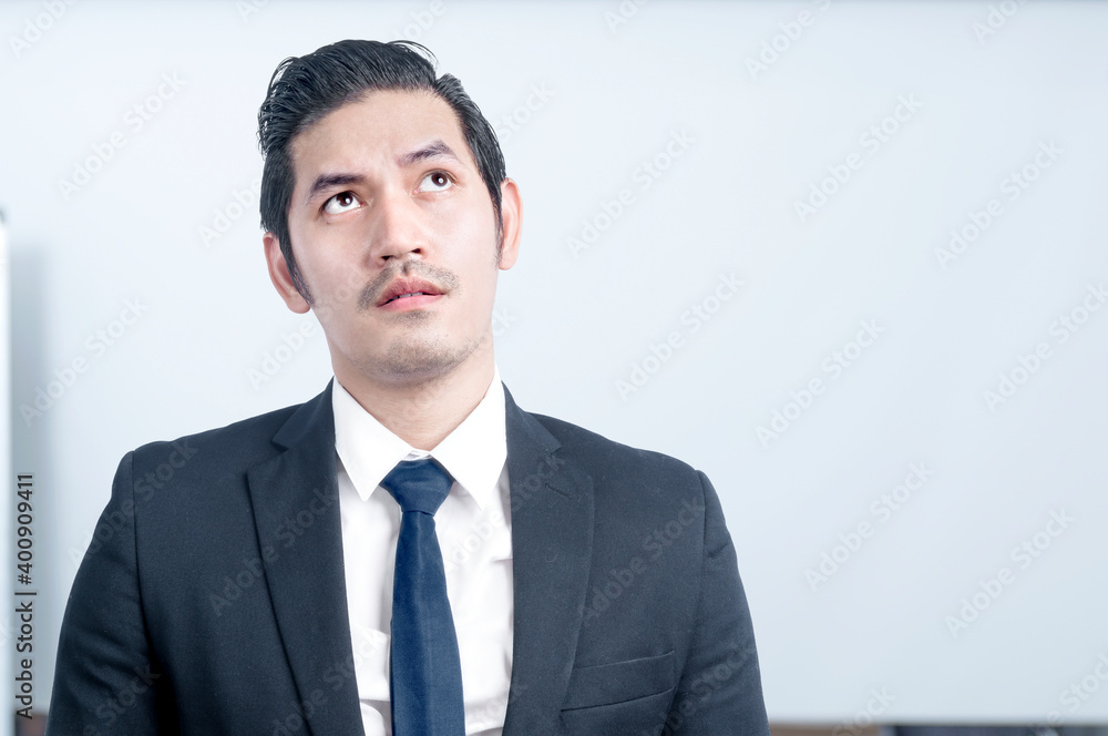 Asian businessman thinking something Asian businessman thinking something