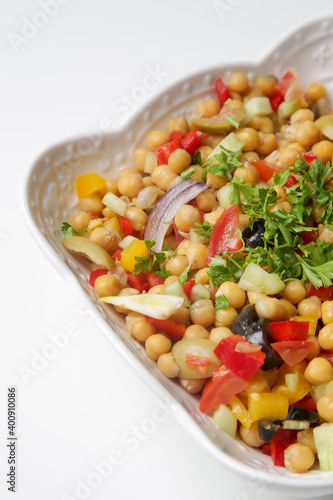 Chickpeas salad with chopped fresh vegetables