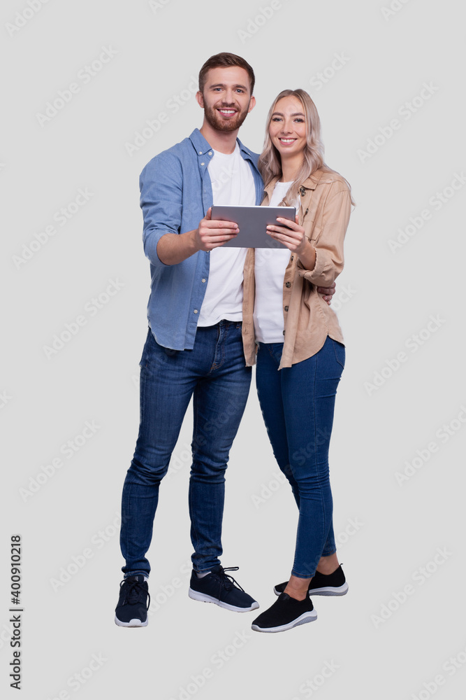 Couple Holding Tablet Standing Isolated. Commecial, Shpping, Advertisment Concept