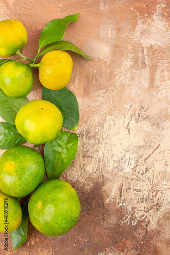 top view sour green tangerines on light background photo exotic citrus fruit tree