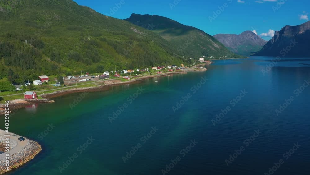 Aerial drone view of wooden Rorbu houses in a fisherman town, on coast of a fjord, in Nordland, Norway Aerial drone view of wooden Rorbu houses in a fisherman town, on coast of a fjord, in Nordland, Norway