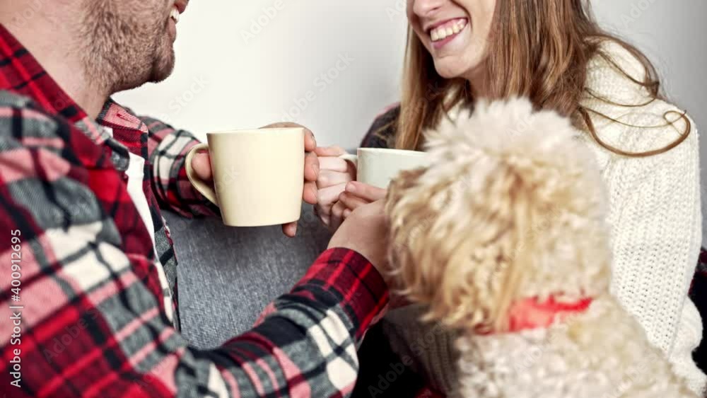 close-up of young people holding cups in their hands and talking honestly with each other close-up of young people holding cups in their hands and talking honestly with each other