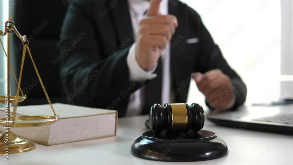 Consult Judge or lawyer Hand Writing Document in Court Room. Consult Judge or lawyer Hand Writing Document in Court Room.