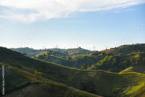 wind turbine landscape natural energy green Eco power concept at wind turbines farm blue sky background. photo