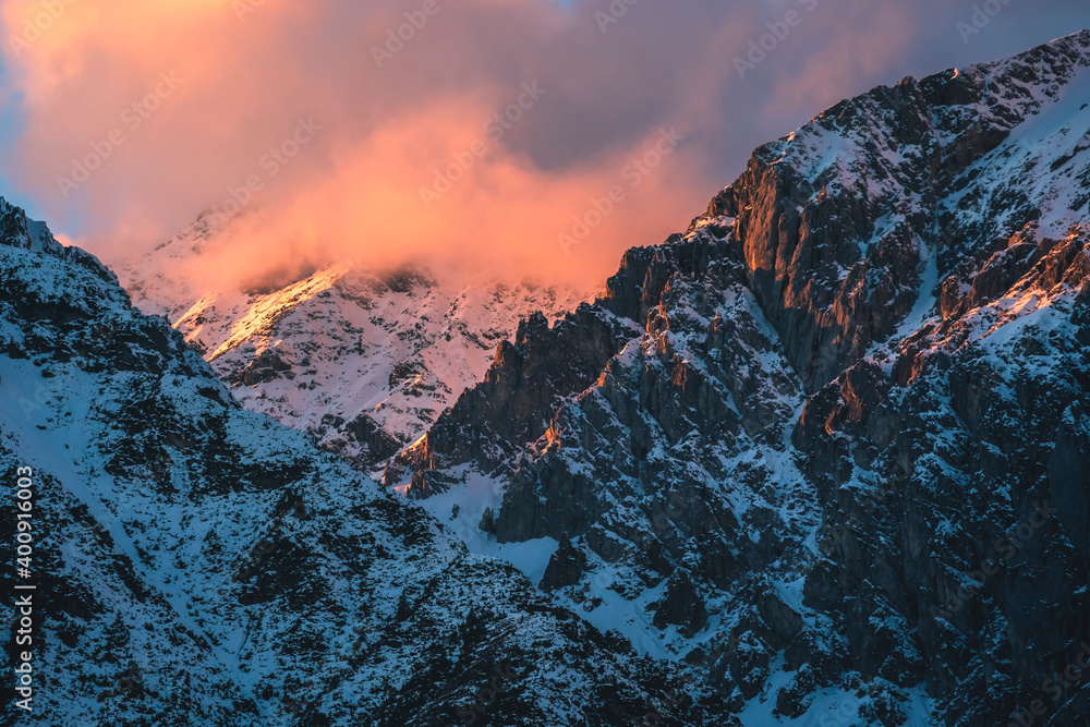Sunset in rocky mountains with sunlit cloud of Austrian Alps in Mieming, Tyrol, Austria