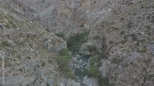 Aerial view of Kourtaliotis Gorge waterfalls in Crete, Greece. Wide angle. Rare footage photo